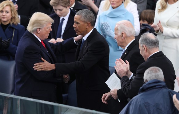 epa08926643 (FILE) - President Donald J. Trump (L) embraces former President Barack Obama (R) after he delivers his Inaugural address after taking the oath of office as the 45th President of the Unite ...