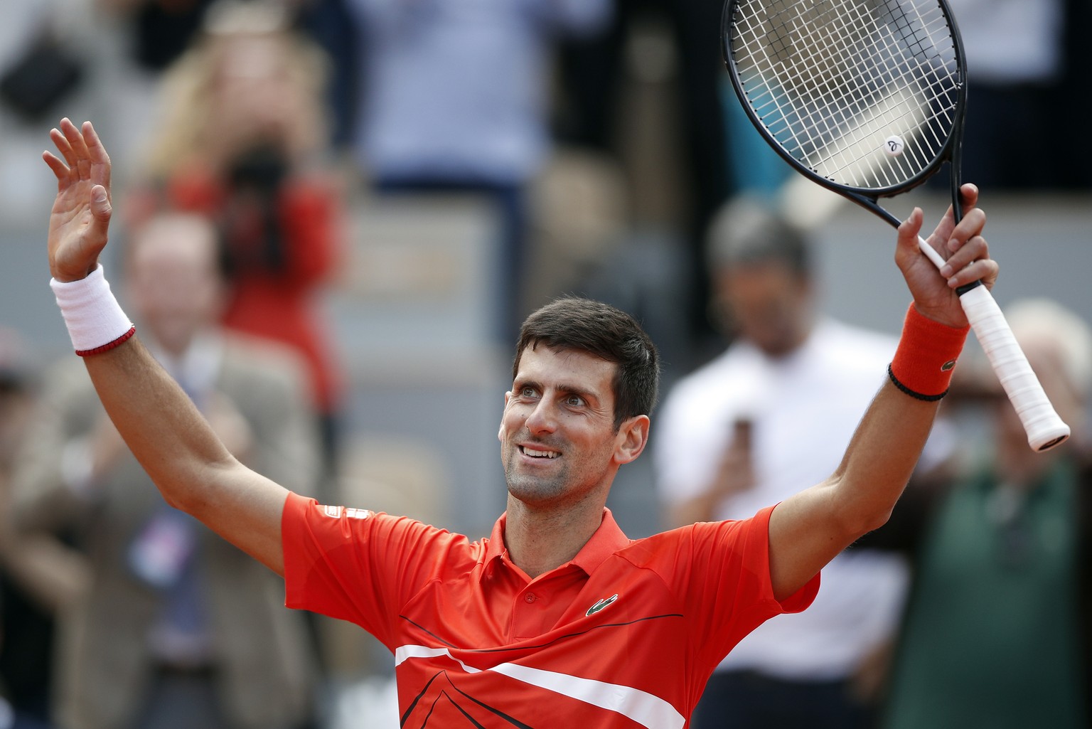 epa07630523 Novak Djokovic of Serbia reacts after winning against Alexander Zverev of Germany their men’s quarter final match during the French Open tennis tournament at Roland Garros in Paris, France ...