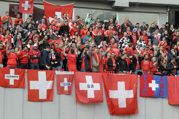 FILE - In this Saturday, March 23, 2019 filer, Switzerland fans shout during the Euro 2020 group D qualifying soccer match between Georgia and Switzerland at Boris Paichadze Erovnuli stadium in Tbilis ...