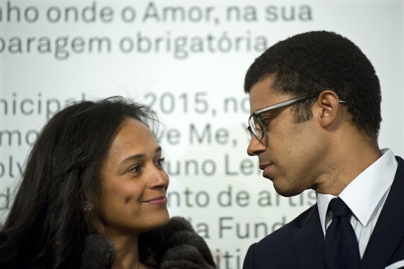 In this March 5, 2015 photo, Isabel dos Santos, reputedly Africa&#039;s richest woman, looks at her husband and art collector Sindika Dokolo during the opening of an art exhibition featuring works fro ...