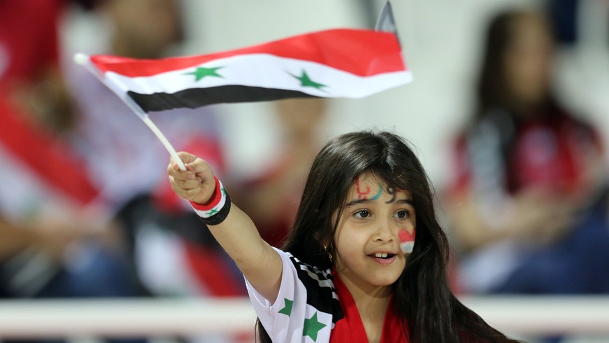 epa07265596 A Syrian fan attends the 2019 AFC Asian Cup group B preliminary round match between Syria and Palestine in Sharjah, United Arab Emirates, 06 January 2019. EPA/MAHMOUD KHALED