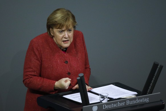 German Chancellor Angela Merkel delivers her speech during the debate about Germany&#039;s budget 2021, at the parliament Bundestag in Berlin, Germany, Wednesday, Dec. 9, 2020. (AP Photo/Markus Schrei ...