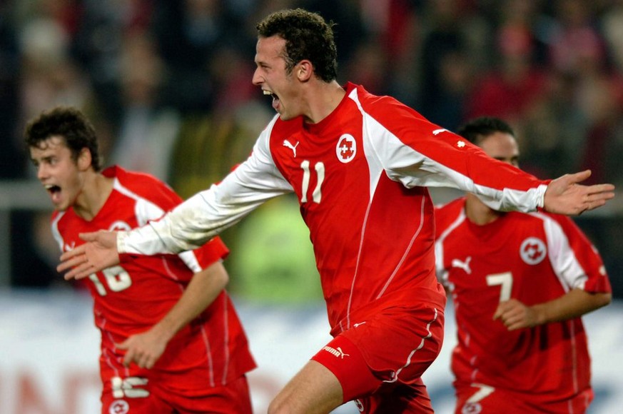 Swiss Marco Streller, center, jubilates after scoring the second goal with Tranquillo Barnetta, left, and Ricardo Cabanas, right, during the FIFA 2006 qualifying play-off second leg soccer match betwe ...