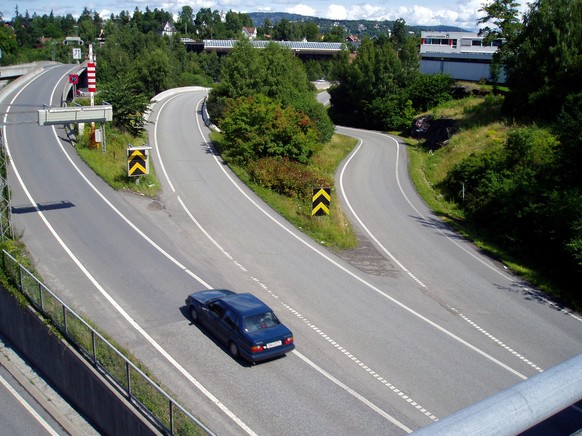 A lone car has it&#039;s choice of entry ramps onto highway E-18, usually one of the busiest roads leading into the Norwegian capital, because the onset of vacation time slows Oslo to a relaxed crawl, ...