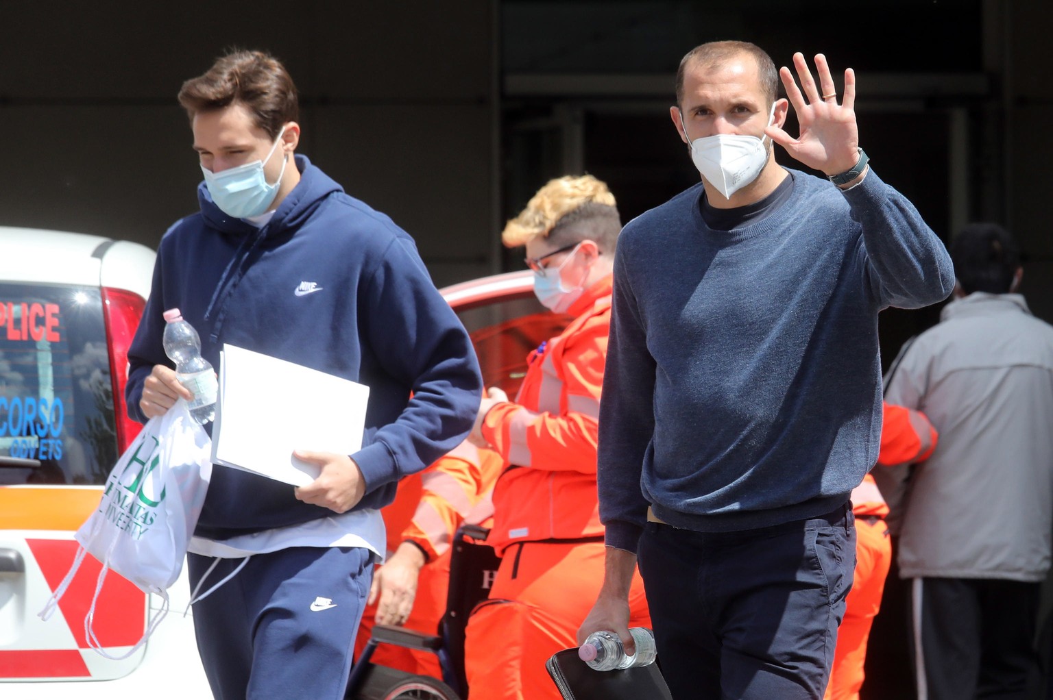 epa09175453 Italian national soccer team players Federico Chiesa (L) and Giorgio Chiellini arrive for a COVID-19 vaccination at Humanitas hospital in Milan, Italy, 03 May 2021. Players of the Italian  ...