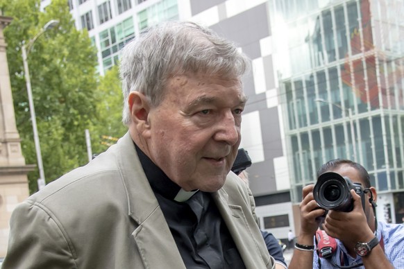 In this Feb. 26, 2019, photo, Cardinal George Pell leaves the County Court in Melbourne, Australia. AustraliaÄôs highest court on Tuesday, April 7, 2020 will judge PellÄôs appeal against convictions ...