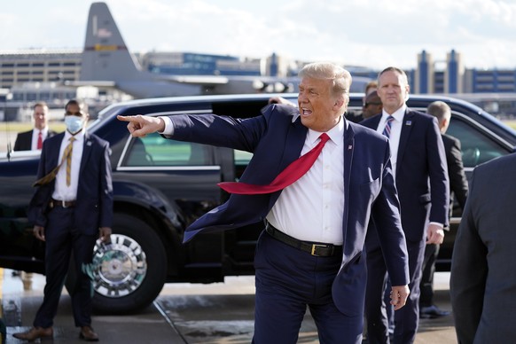 President Donald Trump gestures to supporters as he arrives at Minneapolis Saint Paul International Airport, Wednesday, Sept. 30, 2020, in Minneapolis. (AP Photo/Alex Brandon)
Donald Trump
