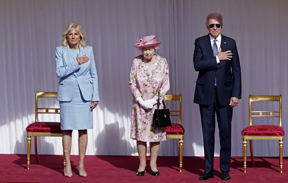 US President Joe Biden, right and First Lady Jill Biden, left, stand with Britain&#039;s Queen Elizabeth II, during a visit to Windsor Castle, in Windsor, England, Sunday June 13, 2021. The queen host ...
