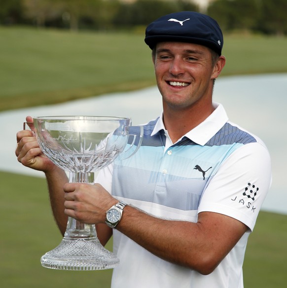 FILE - In this Nov. 4, 2018, file photo, Bryson DeChambeau holds the trophy after winning the Shriners Hospitals for Children Open golf tournament at the TPC Summerlin in Las Vegas. DeChambeau has add ...
