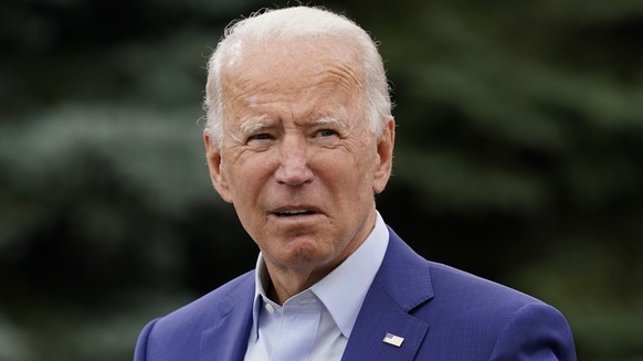 Democratic presidential candidate former Vice President Joe Biden places a note card in his jacket pocket as he speaks at a campaign event on manufacturing and buying American-made products at UAW Reg ...