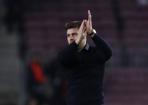 Tottenham coach Mauricio Pochettino applauds fans after the Champions League group B soccer match between FC Barcelona and Tottenham Hotspur, at the Camp Nou stadium, in Barcelona, Spain, Tuesday, Dec ...