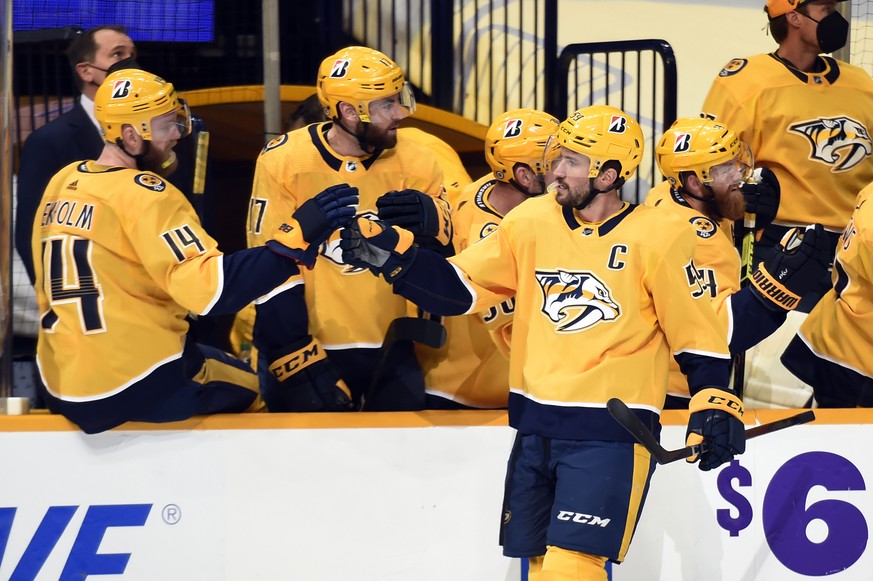Nashville Predators defenseman Roman Josi (59) is congratulated after scoring a goal against the Tampa Bay Lightning during the first period of an NHL hockey game Tuesday, April 13, 2021, in Nashville ...