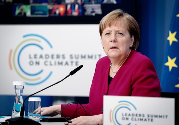 epa09152501 German Chancellor Angela Merkel attends the virtual International Climate Summit with US President Joe Biden (not pictured), in Berlin, Germant, 22 April 2021. The meeting is intended to u ...