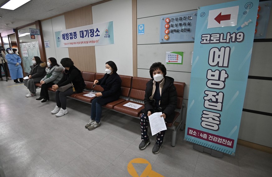 epa09037269 Nursing home workers wait to receive the first dose of the AstraZeneca Covid-19 vaccine at a health care centre in Seoul, South Korea, 26 February 2021. The country kicked off its nationwi ...