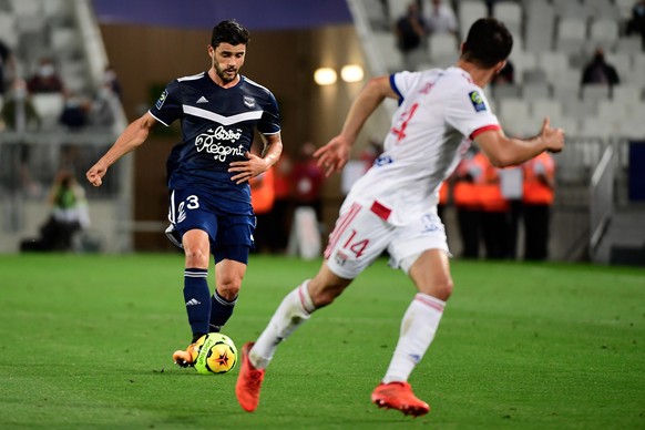 epa08662553 Girondins Bordeaux&#039;s player Loris Benito Souto (L) in action during the French League 1 soccer match between Girondins Bordeaux and Olympique Lyonnais at the Matmut Atlantique Stadium ...
