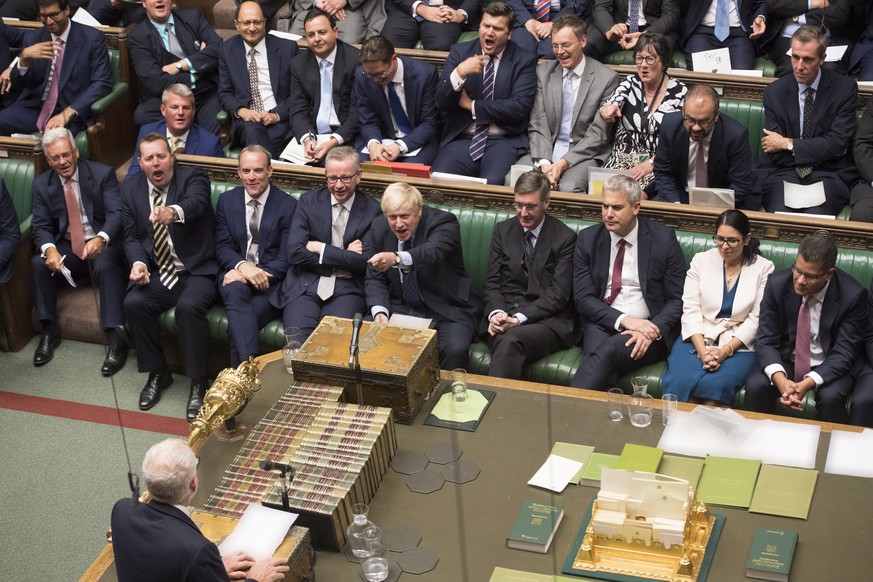 epa07815657 A handout photo made available by the UK Parliament shows British Prime Minister Boris Johnson gesturing to Labour party leader Jeremy Corbyn during a session in the House of Commons in Lo ...