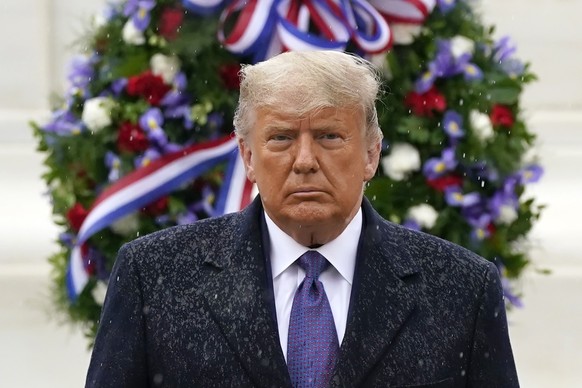 President Donald Trump participates in a Veterans Day wreath laying ceremony at the Tomb of the Unknown Soldier at Arlington National Cemetery in Arlington, Va., Wednesday, Nov. 11, 2020. (AP Photo/Pa ...