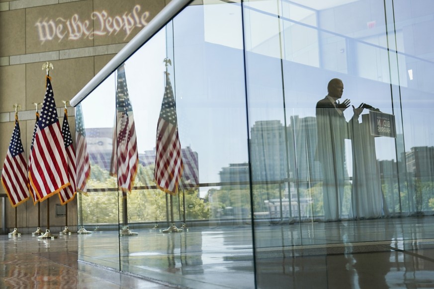 Democratic presidential candidate and former Vice President Joe Biden&#039;s reflection is seen from a glass railing while he speaks at the Constitution Center in Philadelphia, Sunday, Sept. 20, 2020, ...