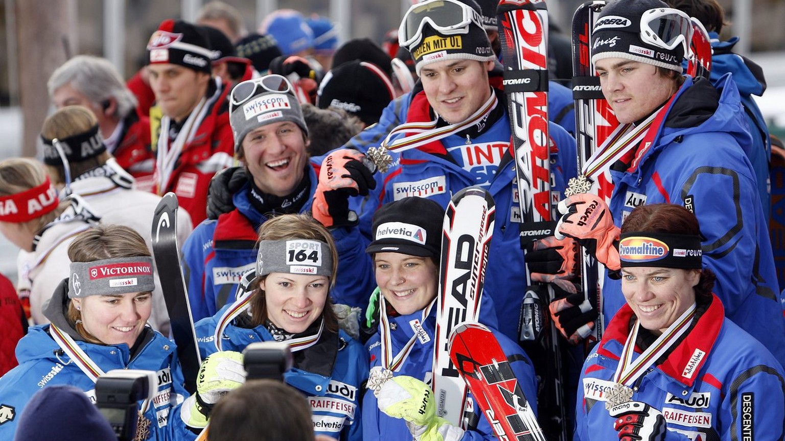 The Swiss team celebrates after clinching the bronze medal of the Nations Team event, at the World Alpine Ski Championships in Are, Sweden, Sunday, Feb. 18, 2007. The athletes are, on top Daniel Albre ...