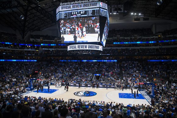 Fans watch the fourth quarter of an NBA game between the Dallas Mavericks and the Denver Nuggets on Wednesday, March 11, 2020 at American Airlines Center in Dallas. The NBA has suspended its season â? ...