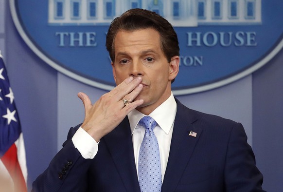In this July 21, 2017 photo, incoming White House communications director Anthony Scaramucci, right, blowing a kiss after answering questions during the press briefing in the Brady Press Briefing room ...