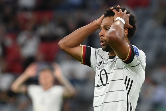 epa09274688 Serge Gnabry of Germany reacts after missing a chance to score during the UEFA EURO 2020 group F preliminary round soccer match between France and Germany in Munich, Germany, 15 June 2021. ...