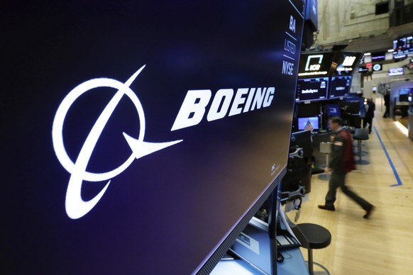 The Boeing logo appears above a trading post on the floor of the New York Stock Exchange before the opening bell, Monday, March 11, 2019. Boeing shares were predicted to fall at the open on Wall Stree ...