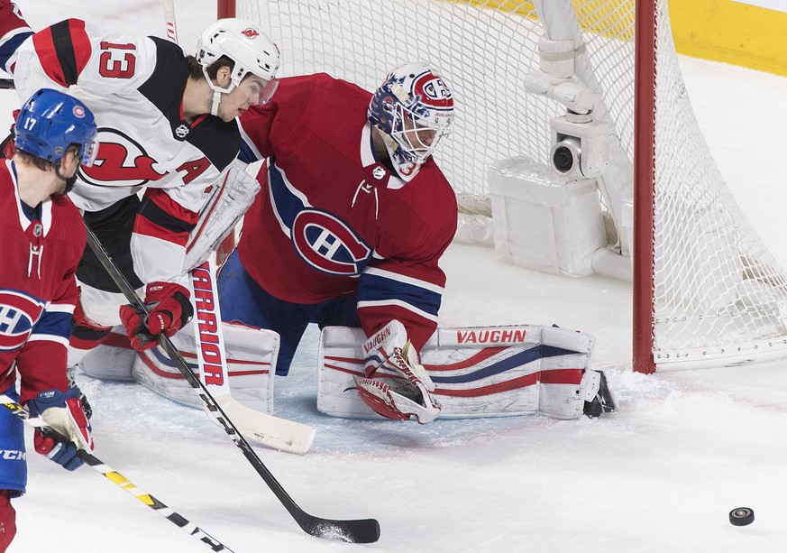 New Jersey Devils&#039; Nico Hischier moves in on Montreal Canadiens goaltender Antti Niemi during the first period of an NHL hockey game in Montreal, Saturday, Feb. 2, 2019. (Graham Hughes/The Canadi ...