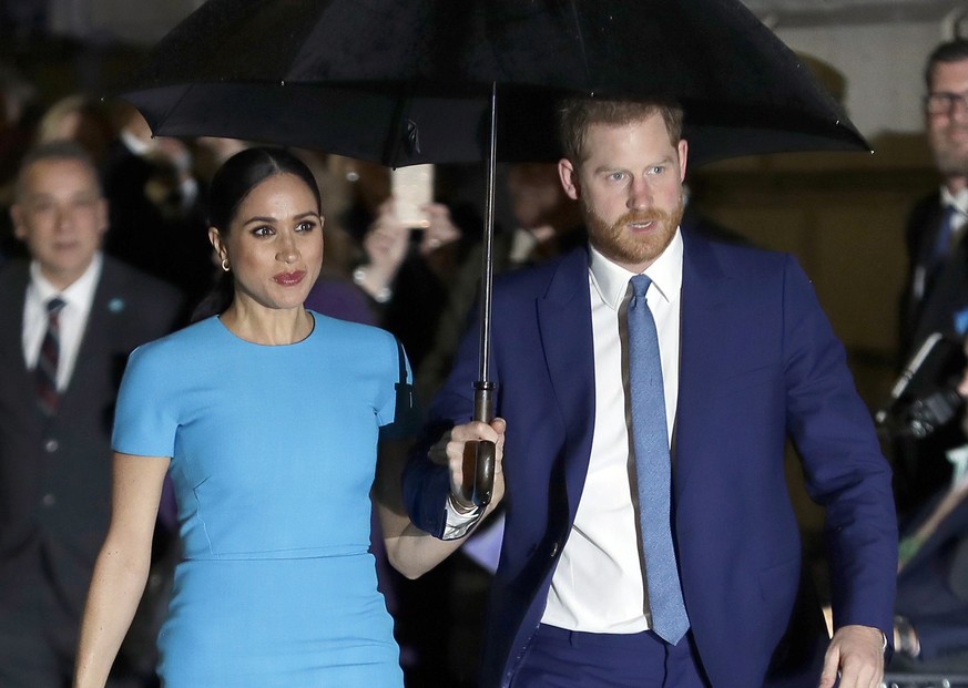FILE - Prince Harry and Meghan, the Duke and Duchess of Sussex arrive at the annual Endeavour Fund Awards in London on March 5, 2020. The Duchess of Sussex has revealed that she had a miscarriage in J ...