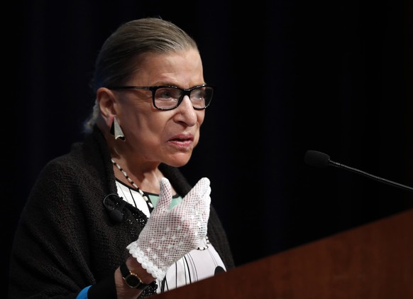 FILE - This Sept. 20, 2017, file photo shows Supreme Court Justice Ruth Bader Ginsburg speaking at the Georgetown University Law Center campus in Washington. Ginsburg didn���t put on her judge���s rob ...