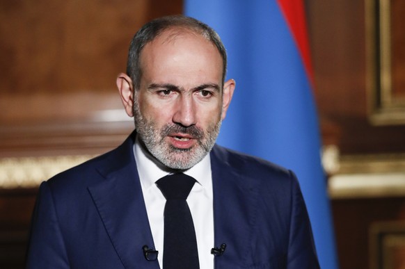 In this photo provided by the Armenian Prime Minister Press Service via PAN Photo, Armenian Prime Minister Nikol Pashinyan addresses the nation in Yerevan, Armenia, Tuesday, Oct. 27, 2020. (Tigran Meh ...