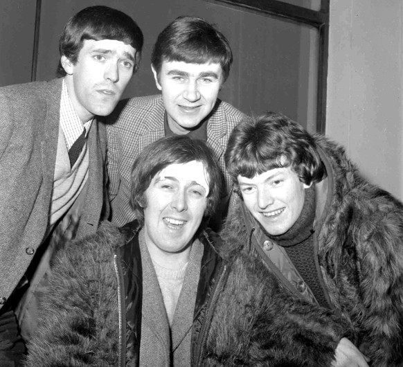 FILE - In this Jan. 10, 1966 file photo, members of the band, the Spencer Davis Group, from top left: Muff Winwood, Pete York and Steve Winwood and Spencer Davis, foreground. British guitarist and ban ...