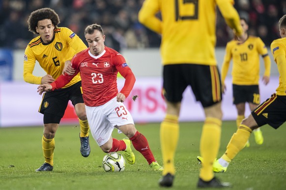 Belgium&#039;s Axel Witsel, left, fights for the ball against Switzerland&#039;s Xherdan Shaqiri, right, during the UEFA Nations League soccer match between Switzerland and Belgium at the swissporaren ...