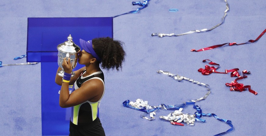 epa08665478 Naomi Osaka of Japan celebrates with the Championship Trophy after defeating Victoria Azarenka to win the Women&#039;s Final match on the thirteenth day of the US Open Tennis Championships ...