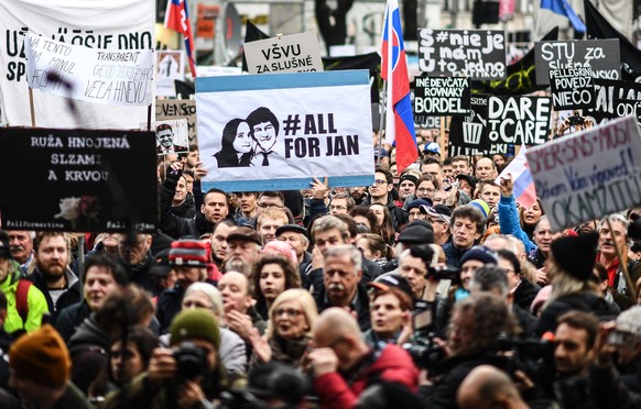 epa06608464 A placard with hashtag #allforJan is seen as people participate in a rally called &#039;Let&#039;s stand for decency in Slovakia&#039; in Bratislava, Slovakia, 16 March 2018. Mass street p ...