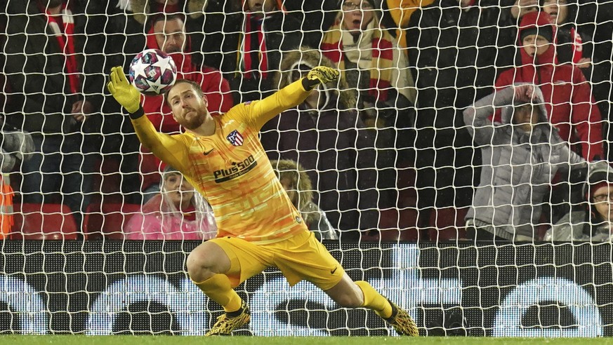 Atletico Madrid&#039;s goalkeeper Jan Oblak makes a save against Liverpool&#039;s Roberto Firmino during a second leg, round of 16, Champions League soccer match between Liverpool and Atletico Madrid  ...