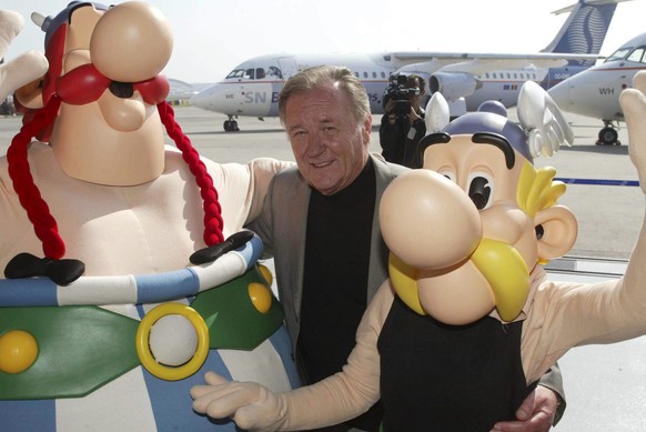 epa08317465 (FILE) - Strip cartoonist Albert Uderzo (C) poses with Asterix and Obelix during the presentation of the two SN Brussels Airlines planes decorated with drawings of famous comic strip Aster ...
