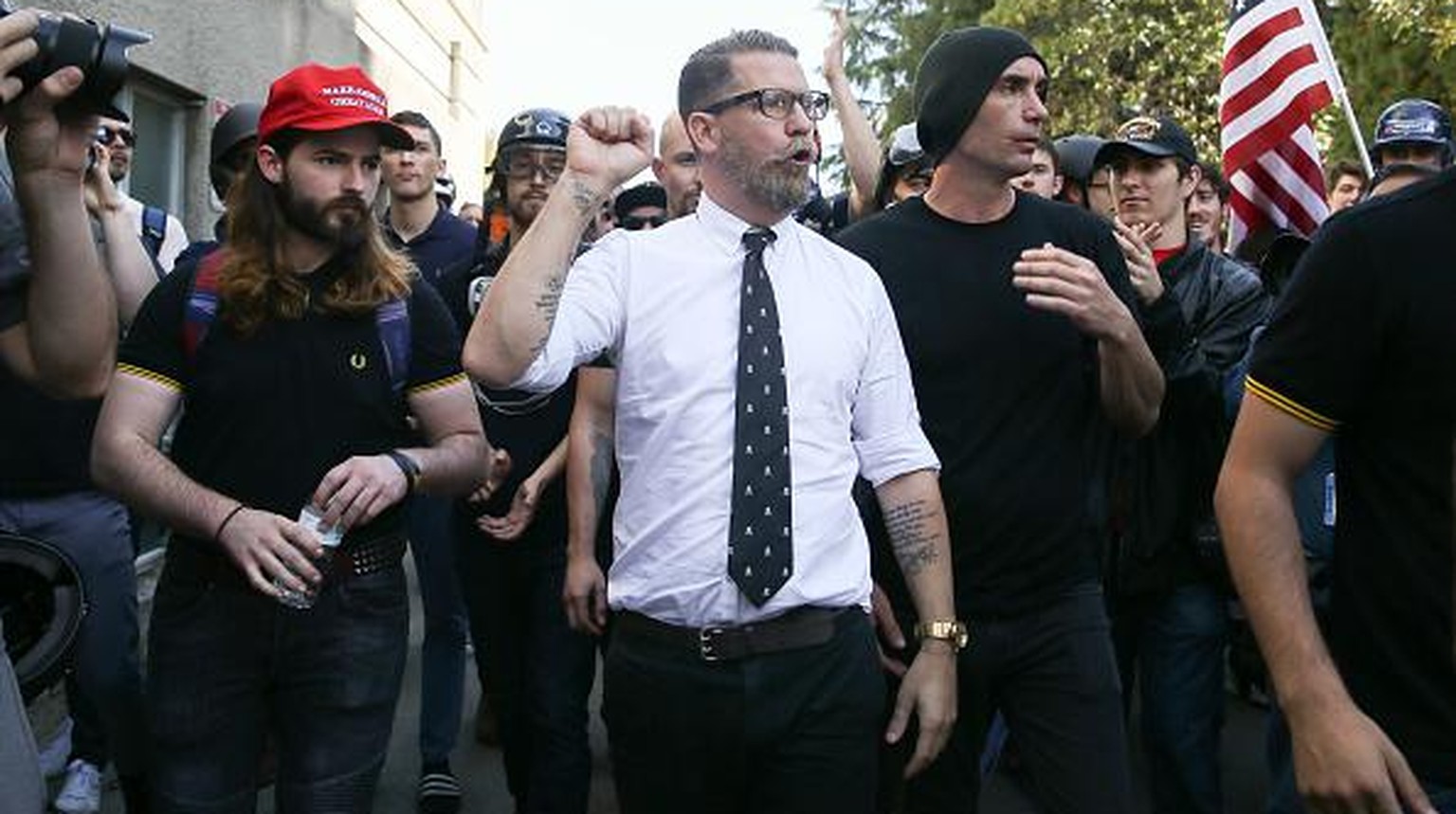 BERKELEY, CA - APRIL 27: Right wing provocateur and Vice co-founder Gavin McInnes (C) pumps his fist during a rally at Martin Luther King Jr. Civic Center Park on April 27, 2017 in Berkeley, Californi ...