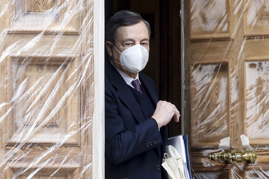 epa08981665 Mario Draghi, former president of the European Central Bank (ECB), leaves his home in Rome, Italy, 02 February 2021. According to media reports quoting party sources, the Italia Viva (IV)  ...