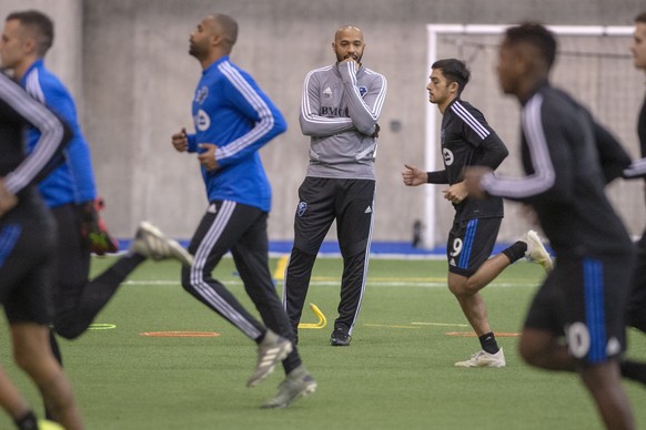 FILE - In this Jan. 14, 2020, file photo, Montreal Impact coach Thierry Henry, center, conducts his first practice with the MLS soccer team in Montreal. resulted in strain during the pandemic. No othe ...