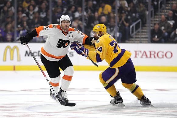 Philadelphia Flyers&#039; Mark Streit, left, of Switzerland, shoves Los Angeles Kings&#039; Dwight King during the first period of an NHL hockey game Friday, Oct. 14, 2016, in Los Angeles. (AP Photo/J ...