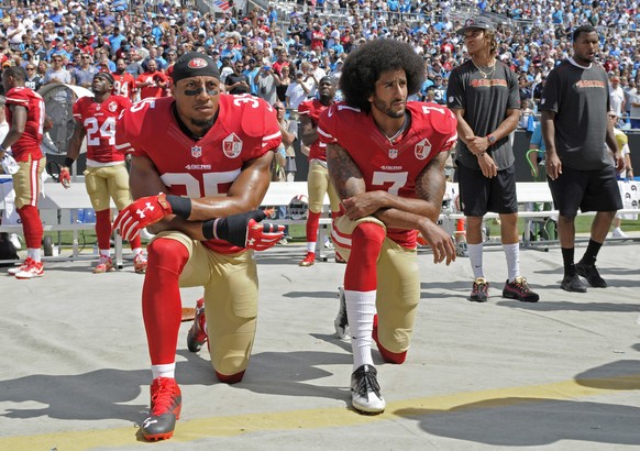FILE - In this Sept. 18, 2016, file photo, San Francisco 49ers&#039; Colin Kaepernick (7) and Eric Reid (35) kneel during the national anthem before an NFL football game against the Carolina Panthers, ...