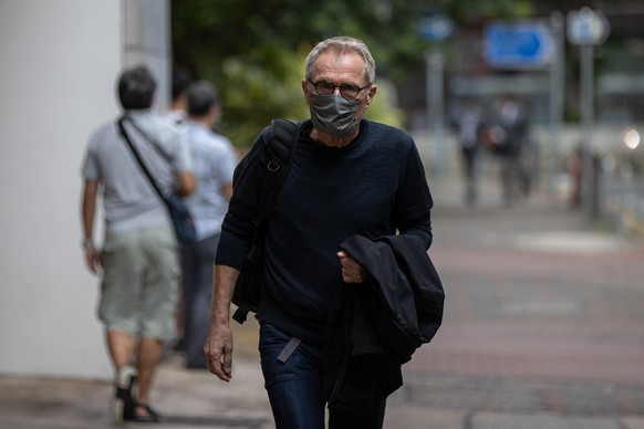 epa08655852 Swiss photographer Marc Progin walks out of the Eastern Law Courts Building in Sai Wan Ho, Hong Kong, China, 09 September 2020. Progin, a long time Hong Kong resident, is on trial, facing  ...