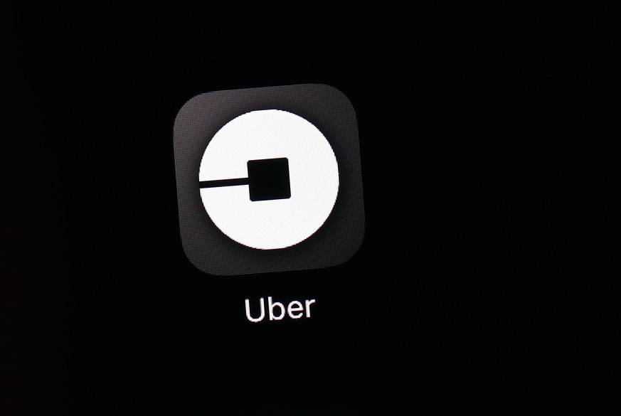 FILE - This March 20, 2018, file photo shows the Uber app on an iPad in Baltimore. Uber is providing a look under the hood of its business in the lead-up to its hotly anticipated debut on the stock ma ...