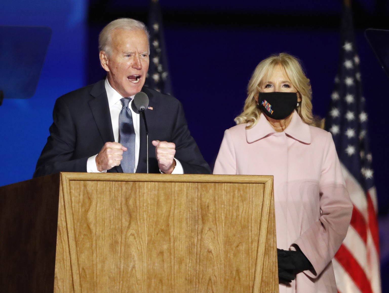 epaselect epa08797583 Democratic Candidate and former Vice President Joe Biden speaks as he stands with Dr. Jill Biden at his Election Night event at the Chase Center in Wilmington, Delaware, USA, 03  ...