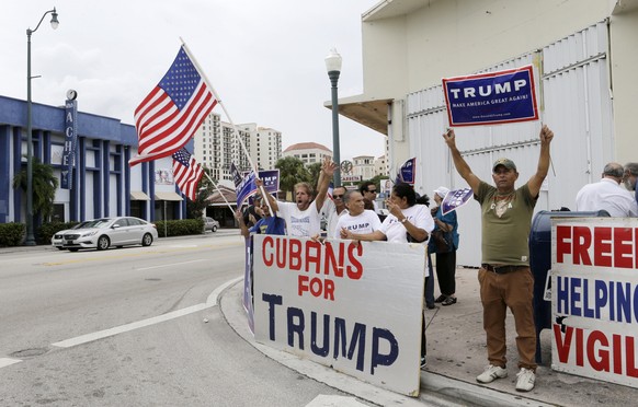 FILE - In this Oct. 28, 2016 file photo, Cuban-Americans chant pro-Trump slogans as they show their support for Republican presidential candidate Donald Trump, in Miami. According to a poll released o ...