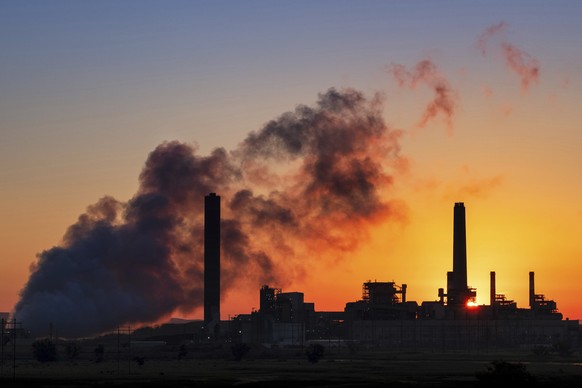 FILE - In this July 27, 2018, file photo, the Dave Johnson coal-fired power plant is silhouetted against the morning sun in Glenrock, Wyo. TThe U.N.���s climate chief Patricia Espinosa says deadlines  ...