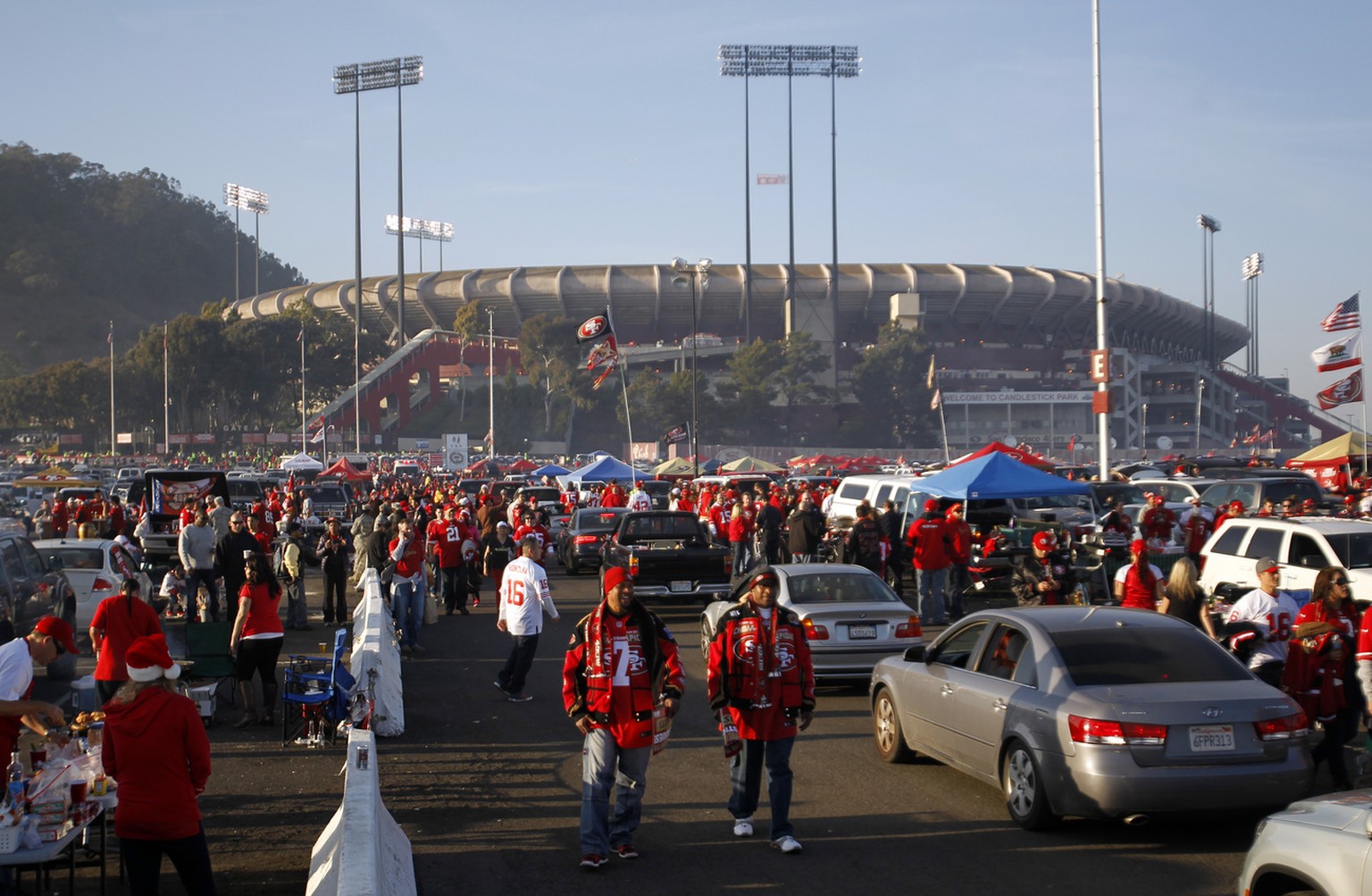 San Francisco 49ers fans tailgate in the parking lot of Candlestick Park before the 49ers game against the Atlanta Falcons NFL football game in San Francisco, Monday, Dec. 23, 2013. (AP Photo/Matt Sum ...