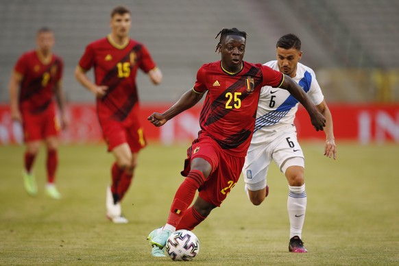 Belgium&#039;s Jeremy Doku, center, is chased by Greece&#039;s Kostas Galanopoulos during the international friendly soccer match between Belgium and Greece at the King Baudouin stadium in Brussels, T ...