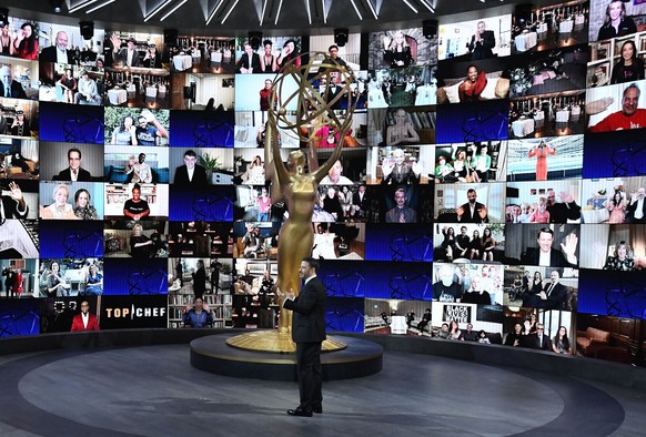 epa08685401 A handout photo made available by the Academy of Television Arts &amp; Sciences shows Jimmy Kimmel (C) hosting the 72nd annual Primetime Emmy Awards ceremony in Los Angeles, California, US ...